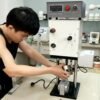 technician connects the plugin charge and assemble the heating flask on injection unit